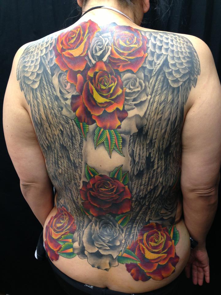  Angel wings & roses tattooed by Brandon Notch 