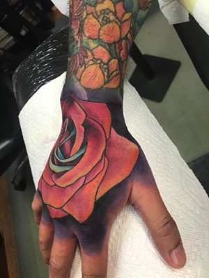  Color rose hand tattoo 