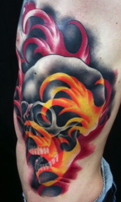  Skull with firewater tattoo by Brandon Notch 