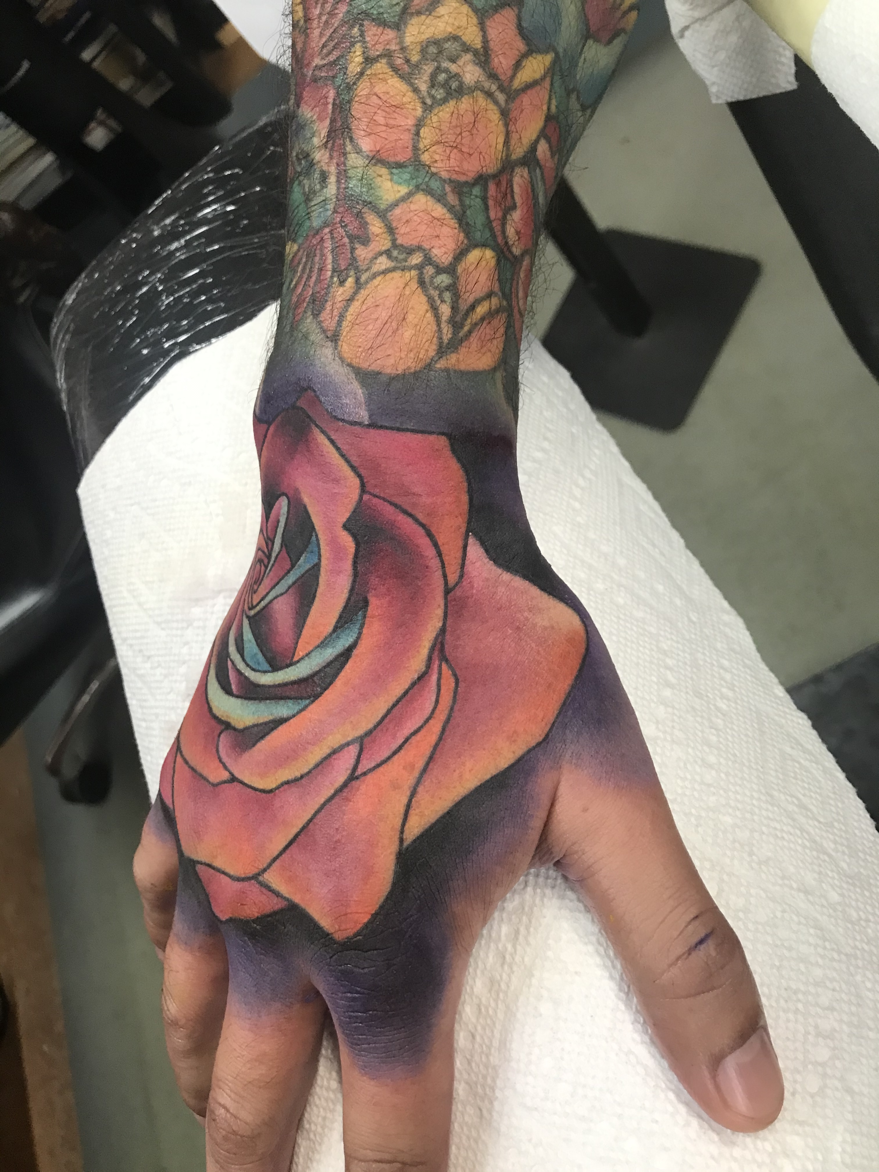  Color rose hand tattoo 