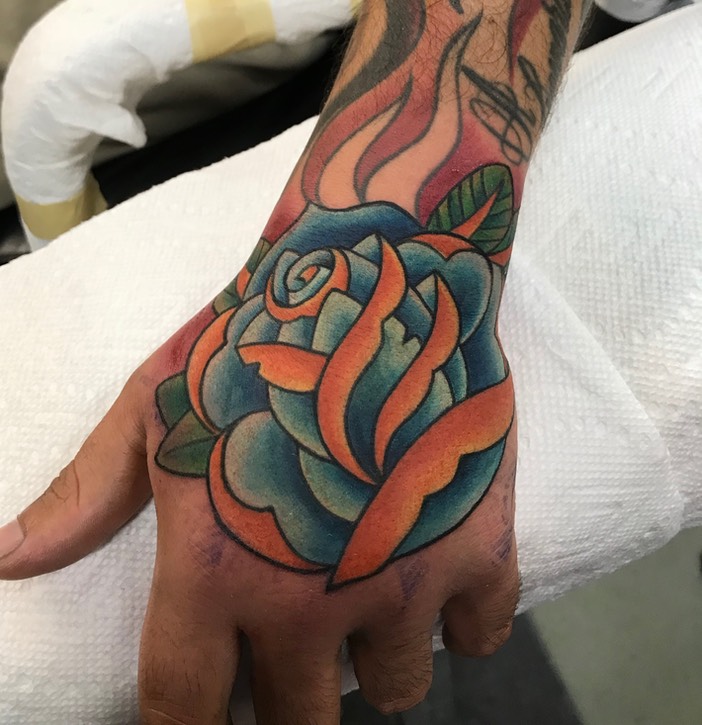  Traditional Rose hand tattoo by Brandon Notch 