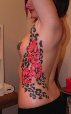  Leopard print and Hibiscus flowers tattoo 