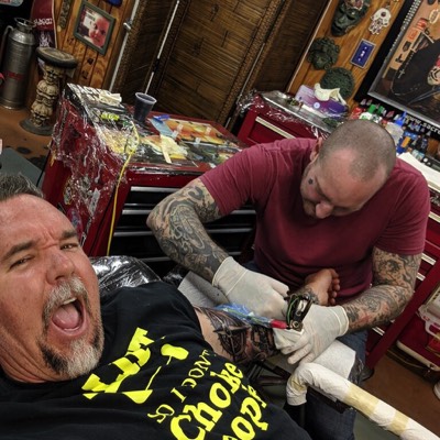  Brandon Notch tattooing the inner arm 