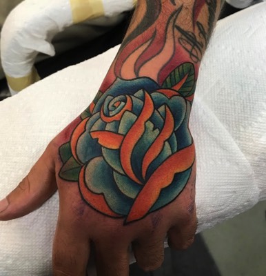  Traditional Rose hand tattoo by Brandon Notch 
