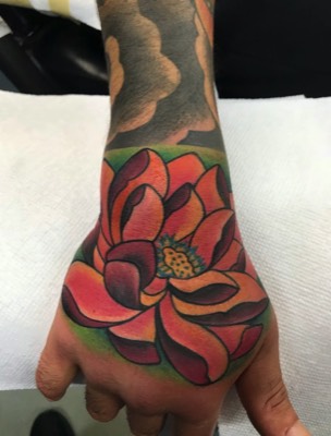  Lotus hand tattoo by Brandon Notch 