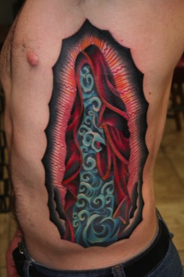  Water Virgin Mary tattoo by Brandon G Notch. (Design by Don Ed Hardy) 